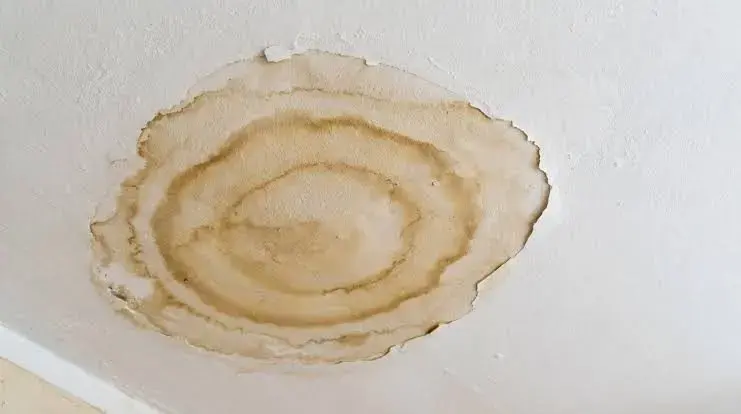Ring-shaped water stain on a ceiling below an attic air handler