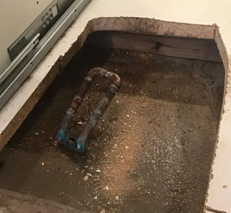 Slab opened to expose a leaking copper line under a Carrollton home